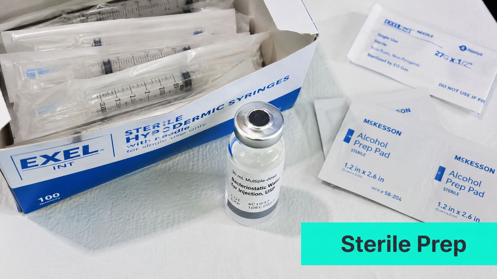 A box of sterile hypodermic syringes, a vial of bacteriostatic water, and alcohol prep pads for injections.